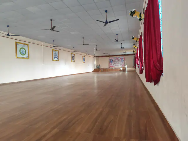 Spacious auditorium hall with a wooden floor