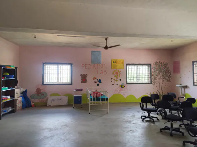 Paediatric nursing laboratory with cots and child-care displays